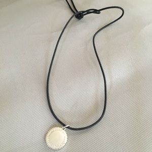 India Hicks silver charm and black cord necklace.